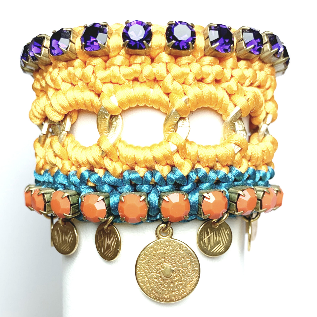 GAIA CUFF BRACELET IN ORANGE AND TURQUOISE SILK THEAD AND DARK PURPLE AND ORANGE OPAQUE SWAROVSKI CRYSTAL CUP CHAIN DETAIL AND 24K GOLD PLATED DISC DROPS