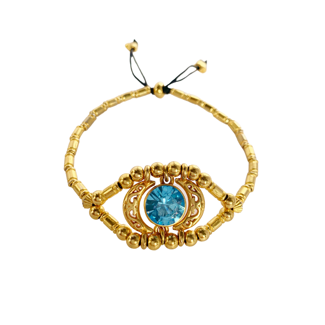 EYE CANDY BRACELET WITH 24K GOLD PLATED BEADS AND TURQUOISE SWAROVSKI CRYSTAL CENTRE