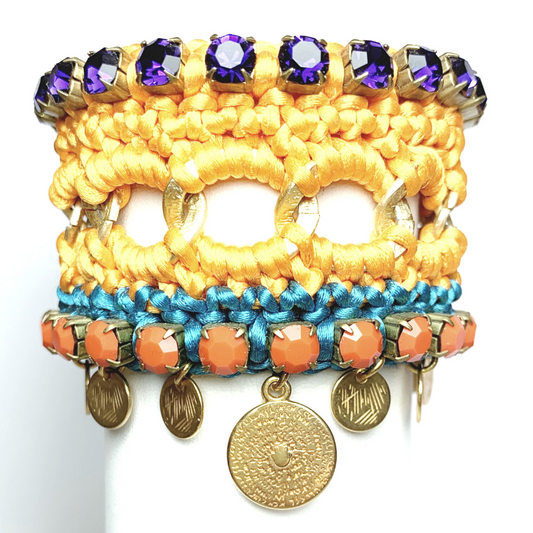 GAIA CUFF BRACELET IN ORANGE AND TURQUOISE SILK THEAD AND DARK PURPLE AND ORANGE OPAQUE SWAROVSKI CRYSTAL CUP CHAIN DETAIL AND 24K GOLD PLATED DISC DROPS