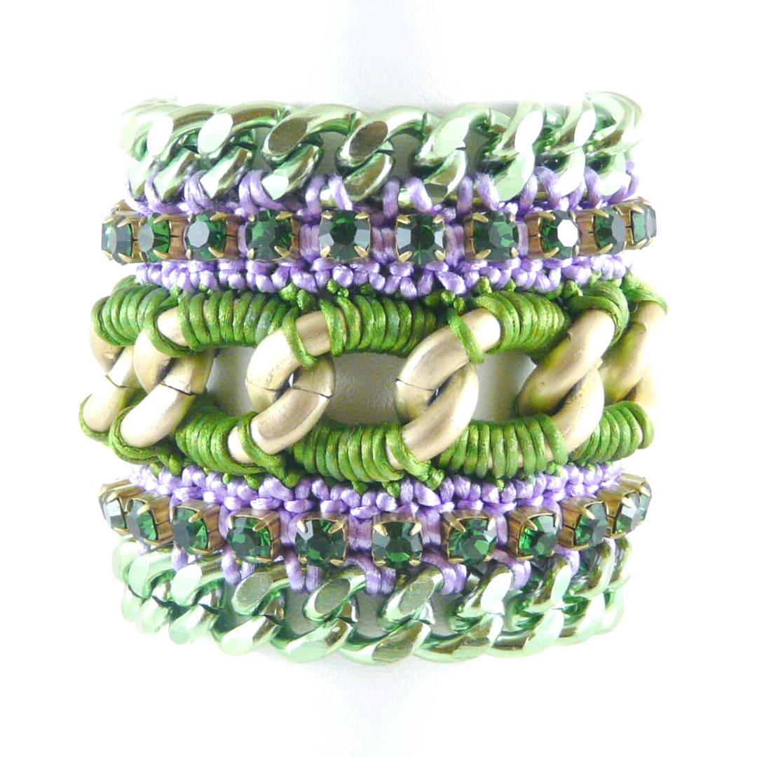 MUSES CUFF BRACELET IN GREEN AND LILAC SILK THREAD, EMERALD SWAROVSKI CRYSTAL CUP CHAIN AND GREEN CHAIN DETAIL