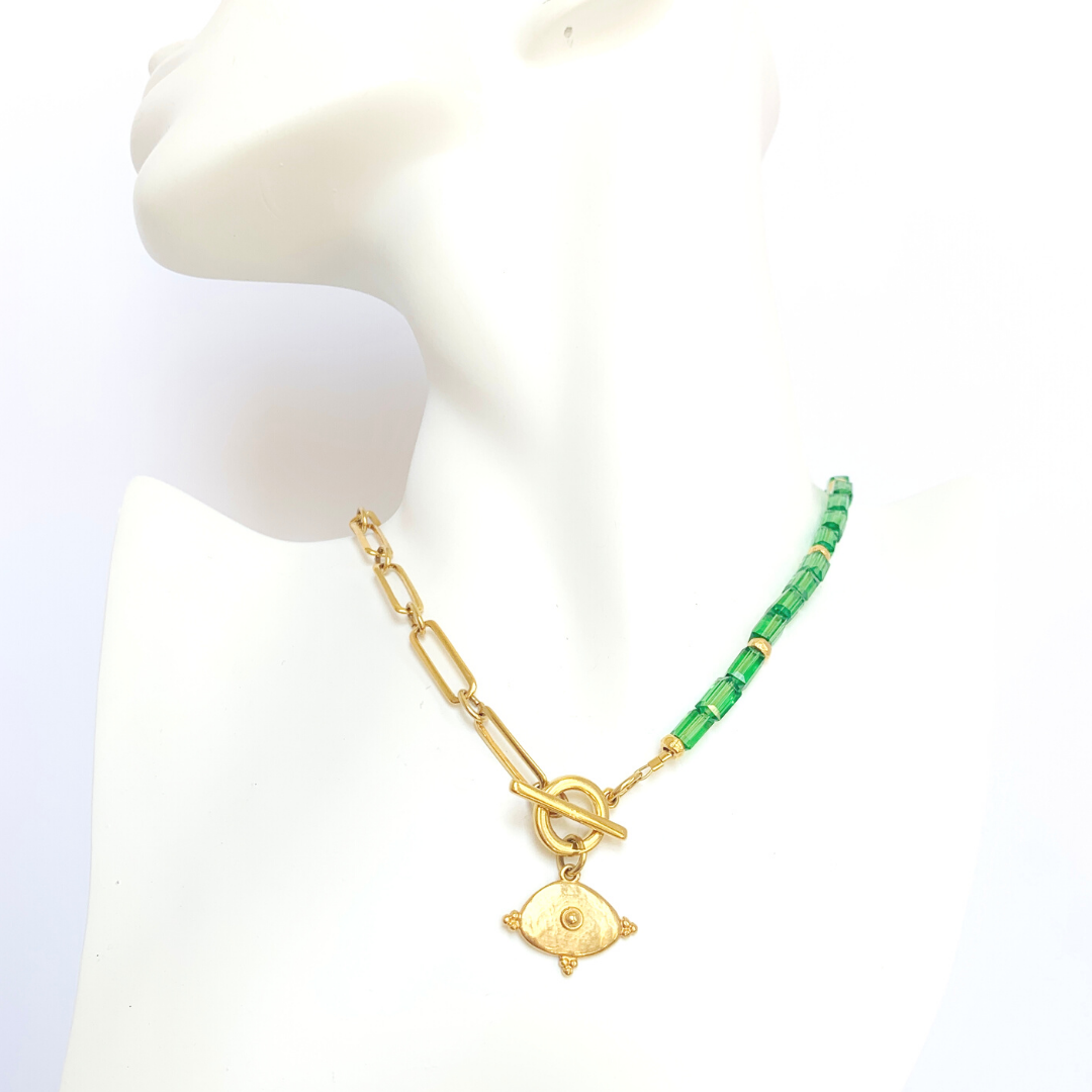 YANG HALF NECKLACE WITH EMERALD AUSTRIAN CRYSTALS AND 24K GOLD PLATED OVAL BYZANTINE MOTIF